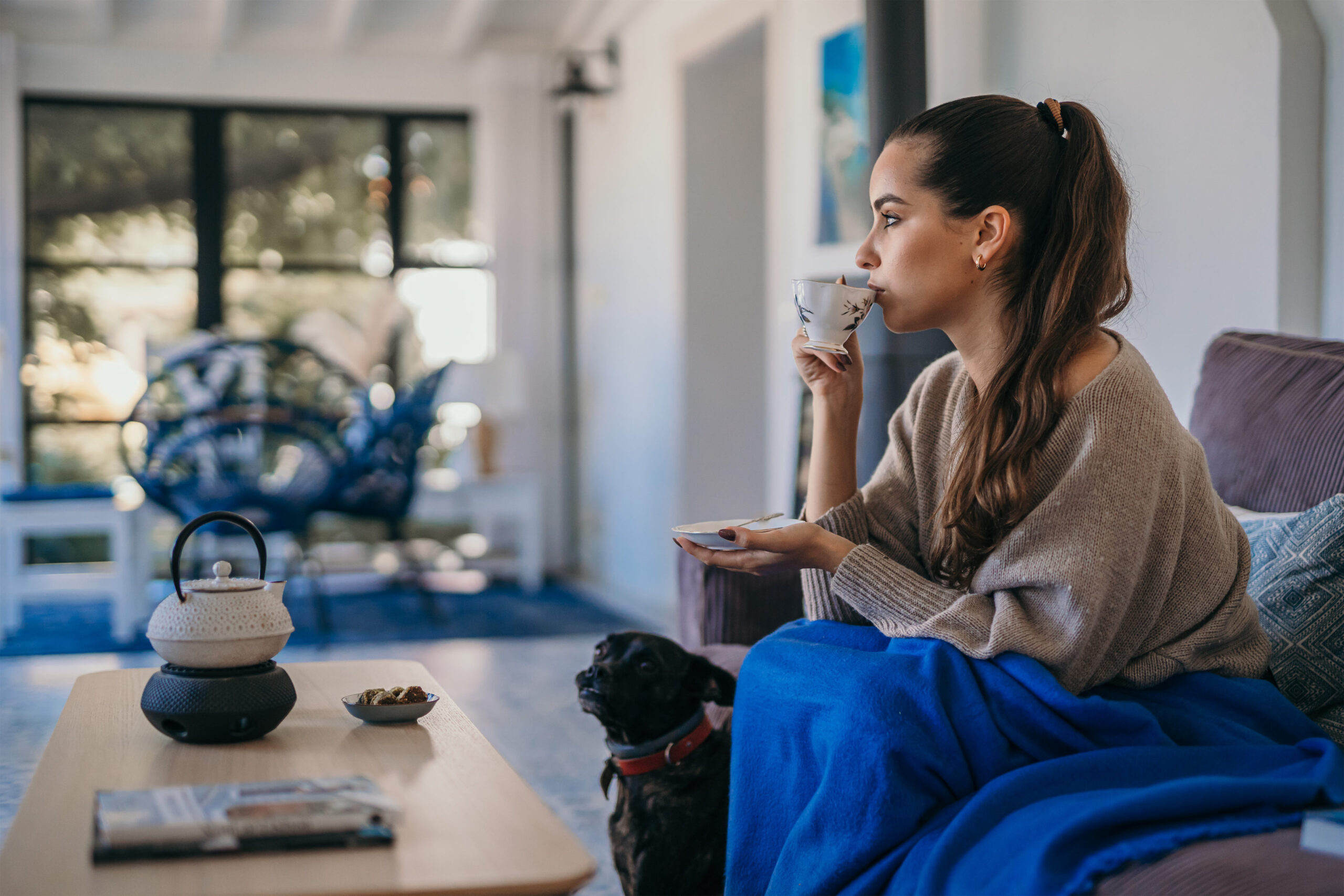 a woman drinking a warm drink