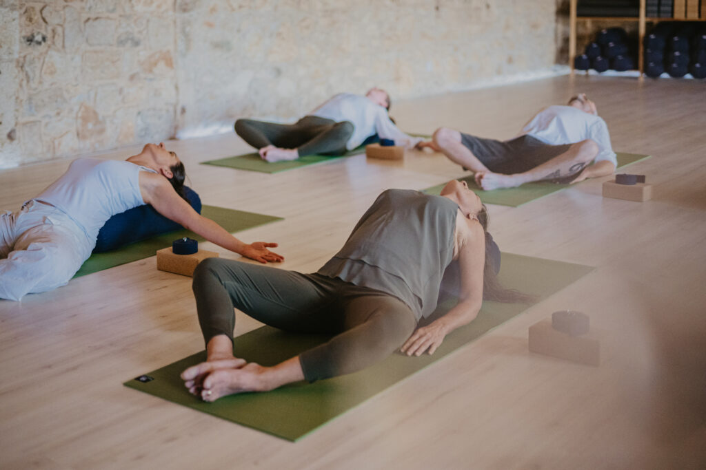 group of people doing yoga